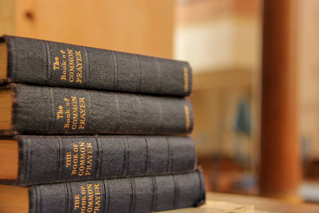 A stack of Books of Common Prayer